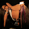 The Rough-Out Rough Rider - Colt Starter, Wade Tree, 15 and 1/2 inch seat, Gullet - 7 and 1/2 inch by 6 and 1/4 inch by 4 inch, Horn 4 and 1/4 by 4 inch Guatelajara, 92 degree bars, 7/8ths flat palte riggin, Cheyenne Roll, built by Keith Valley.